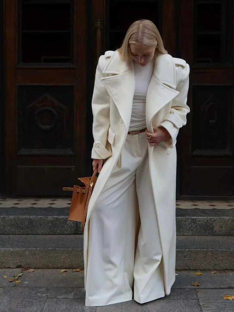 Women’s long wool overcoat with elegant design, stylish lace-up, and pockets — unmatched warmth and elegance for Autumn/Winter 2025.