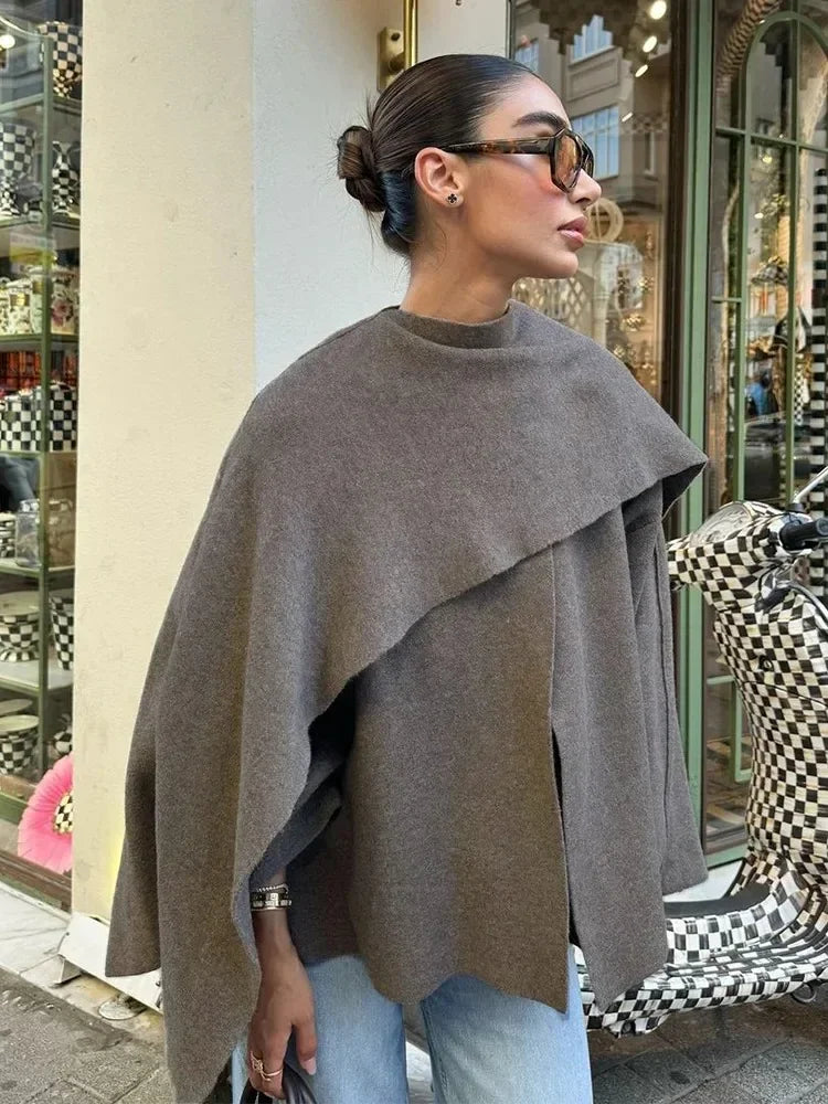 Luxurious knitted coat with asymmetric design — elegance and cozy warmth in one.