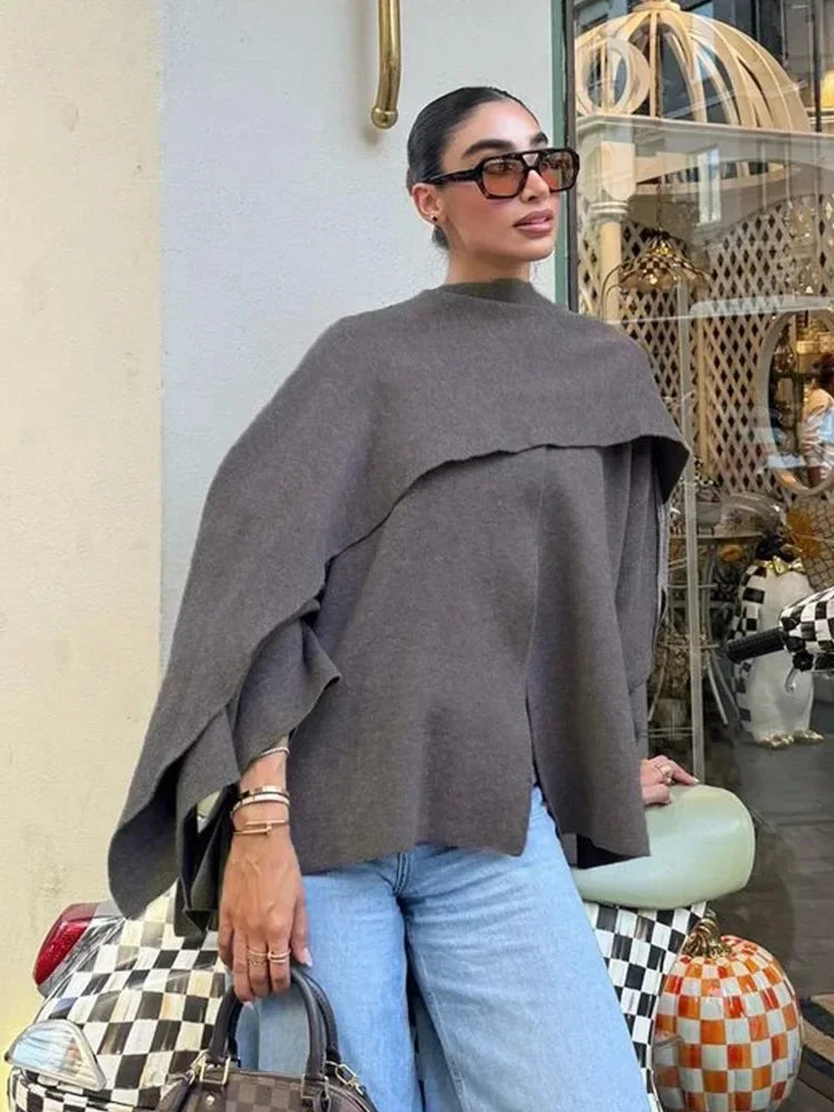 Luxurious knitted coat with asymmetric design — elegance and cozy warmth in one.