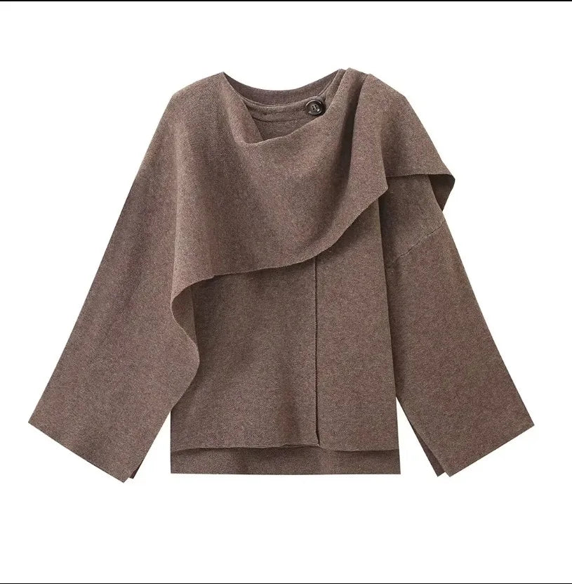 Luxurious knitted coat with asymmetric design — elegance and cozy warmth in one.