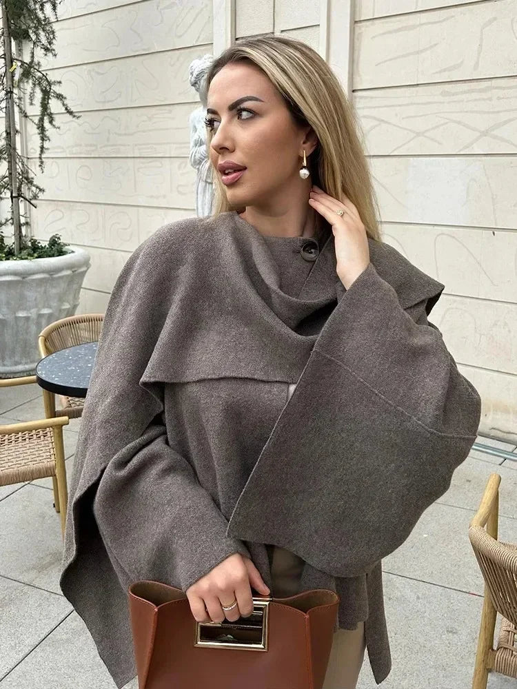 Luxurious knitted coat with asymmetric design — elegance and cozy warmth in one.