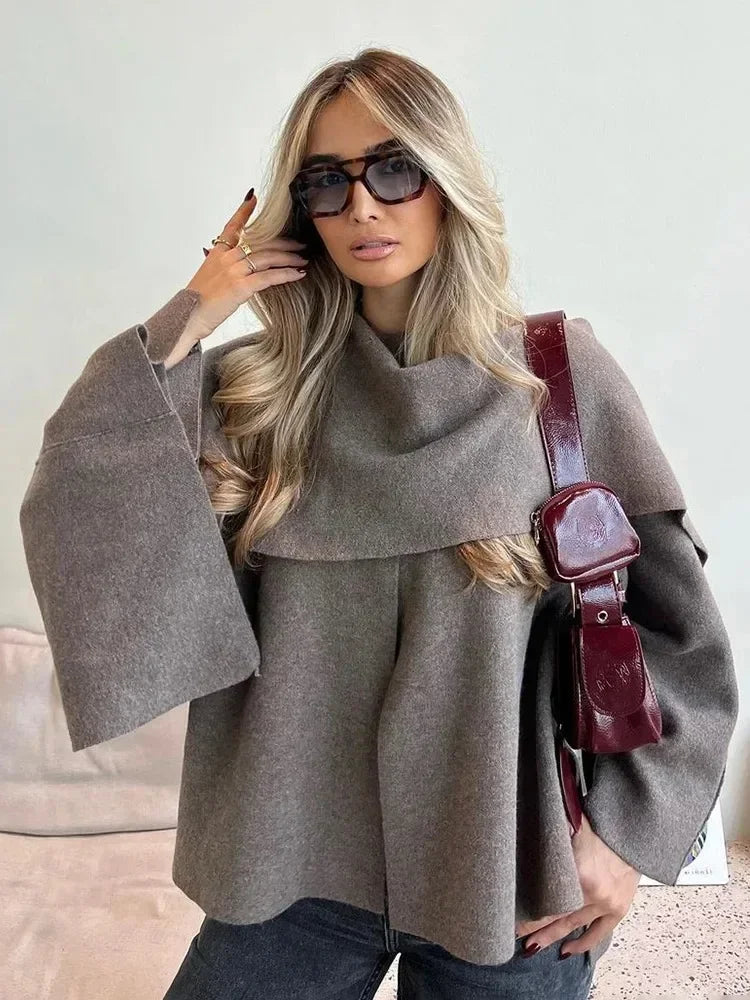 Luxurious knitted coat with asymmetric design — elegance and cozy warmth in one.