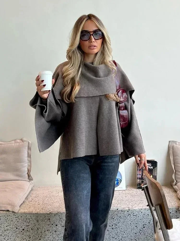 Luxurious knitted coat with asymmetric design — elegance and cozy warmth in one.