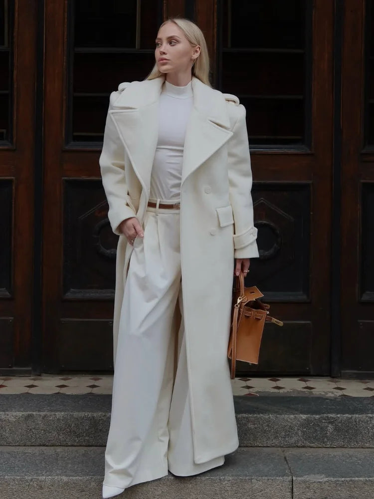 Women’s long wool overcoat with elegant design, stylish lace-up, and pockets — unmatched warmth and elegance for Autumn/Winter 2025.