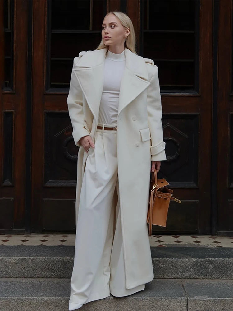 Women’s long wool overcoat with elegant design, stylish lace-up, and pockets — unmatched warmth and elegance for Autumn/Winter 2025.